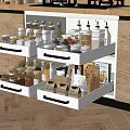 Organized Kitchen Tools And Spice Jars Storage In White Drawers With Light Wooden Cabinets