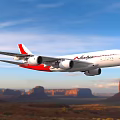 Red and White Passenger Plane Flying Over Mountainous Landscape With Blue Sky and Green Vegetation