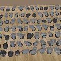 Various Casters And Wheels Scattered On Wooden Floor With Different Styles