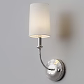 Modern Wall Lamp With Fabric Shade And Chrome Finish Mounted On Light Gray Wall