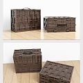 Two Brown Wooden Storage Chests With Woven Pattern And Metal Clasps On Wooden Floor