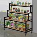 Multi Tier Rolling Plant Stand With Colorful Potted Flowers And Green Plants For Indoor Garden Decor