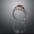 Silver Ring Featuring Red Central Gemstone Green Accent Stones And Intricate Carvings
