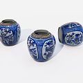 Three Blue and White Ceramic Jars With Intricate Scenic Patterns on White Background
