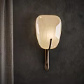 Wall Sconce With Ivory Translucent Lampshade Soft Lighting And Metal Base On Dark Wall