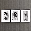 Black and White Female Portrait Art Three Framed Prints on Gray Wall