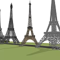 Multiple Eiffel Tower Replicas with Various Designs Displayed on Green Lawn 3d model