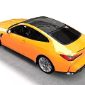 Yellow Two Door Sports Car With Black Roof And Alloy Wheels On Road