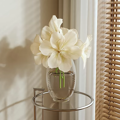White Lilies in Transparent Glass Vase on Metal Stand Near Window Blinds 3d model