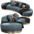 Stylish Blue Irregular Shaped Sofa With Decorative Pillows And Black Throw Blanket