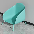 Turquoise Leisure Chair with Sleek Curved Back and Metal Legs in Modern Indoor Space