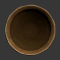 Handwoven Natural Fiber Container With Textured Surface And Wide Rim Design