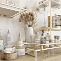 Bathroom Essentials Display With Golden Shelves Rolled Towels And Decorative Bottles