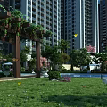 Modern Garden Landscape With Pergola Green Lawn Pool And Tall Buildings