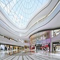 Modern Shopping Mall Atrium With Glass Dome Ceiling Multiple Levels Luxury Shops And Bright Lighting