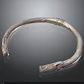 Silver Circular Collar Fashion Accessory With Carved Dragon Head Ends And Textured Surface Design