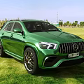 Green Mercedes AMG Sporty SUV With Bold Front Grille And Alloy Wheels On Grass Field