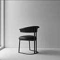 Modern Minimalist Black Dining Chair With Leather Seat And Metal Frame By The Window