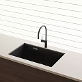 Black Kitchen Sink With Modern Curved Faucet On Light Countertop Against Vertical Striped White Wall