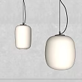 Modern Pendant Lights With Two White Shades And Black Cords On Gray Wall