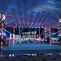 Eye Catching Stage Design With Colorful Lights Large Screens And MOMENT Text Elements