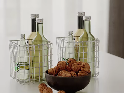 Metal Wire Baskets Holding Wine Bottles and Black Bowl With Walnuts on Tabletop 3d model