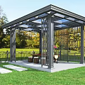 Outdoor Pavilion With Metal Frame Glass Roof In Grass Lawn With Trees Fence Table Chairs