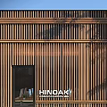 Modern Storefront with Wooden Slats HINOKI Signage and Glass Door Design