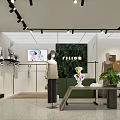 Modern Green Facade Clothing Store With Mannequins Window Displays And Lighting
