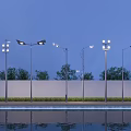 Outdoor Street Lights And Floodlights With Evening Sky Water Reflection And Trees