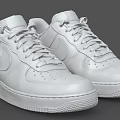 Pair of White Leather Low Top Sneakers With Lace Up Design And Comfortable Sole