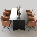 Modern Dining Table Set Featuring Black Tabletop Eight Beige Chairs And Decorative Pampas Grass Vase