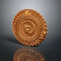 Ornamental Golden Carved Plate With Intricate Circular Patterns And Central Dot