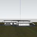 Modern Sales Office Building with Curved Glass Facade Surrounded by Grass Trees and Illuminated Interior
