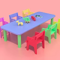 Colorful Kids Table and Chairs Set with Blue Table Various Colored Chairs and Toys on Top