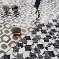 Stylish Black And White Geometric Pattern Floor Tiles In Public Lobby With Pedestrian