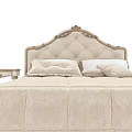Elegant Beige Double Bed With Carved Headboard Quilted Bedspread And Bedside Tables