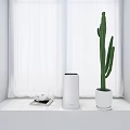 LEVOIT Air Purifier on Windowsill in White Room with Cactus Tray Cups and Mobile Phone