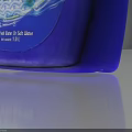 Household Laundry Detergent in Blue Plastic Bottle with Handheld Design and Foam Water Drop Pattern