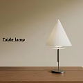 Stylish Table Lamp With White Cone Lampshade Black Stem On Wooden Tabletop Beige Background Wall