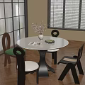 Round White Dining Table Set with Mixed Design Chairs Green White Cushions Vase and Book