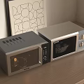 Modern Kitchen Appliances Two Sleek Silver Microwave Ovens On Wooden Countertop