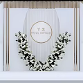 Banquet Hall With White Aisle Green Plant Decorations And Crystal Chandelier Lighting