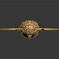 Golden Animal Sculpture With Bat Wings And Lion Like Features On Reflective Surface