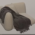 Cozy Beige Armchair Featuring Soft Cushion And Dark Gray Fringed Blanket