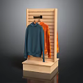 Wooden Display Rack With Blue And Orange Hoodies On Stand
