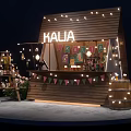 HALIA Wooden Stall Decorated With String Lights Bunting Flags Wine Barrels And Flowers