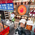 Mingdong Street Mall Snack Shop Featuring Orange Signage Grilled Cold Noodles Octopus Balls Display Shelves