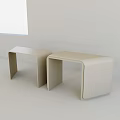 Two Modern Beige Stools With Smooth Surface And U Shaped Legs For Minimalist Indoor Space