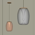 Modern Pendant Lights With Transparent Glass And Warm Orange Tones In Minimalist Interior